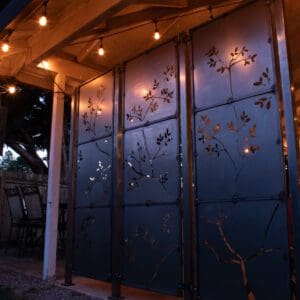 A room with some lights and a metal screen