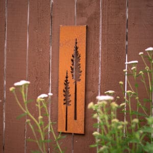 A wooden sign hanging on the side of a house.