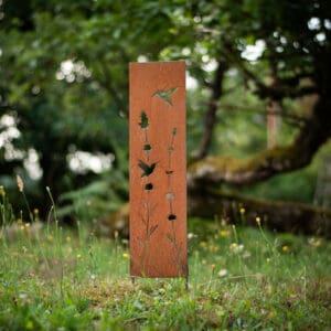 A tall metal sign in the middle of a field.