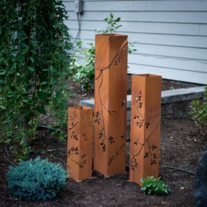A group of four tall orange blocks in the ground.