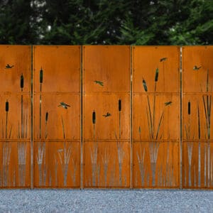 Decorative metal screen with dragonfly design.