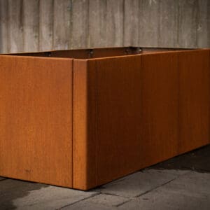Rust-colored metal raised planter box