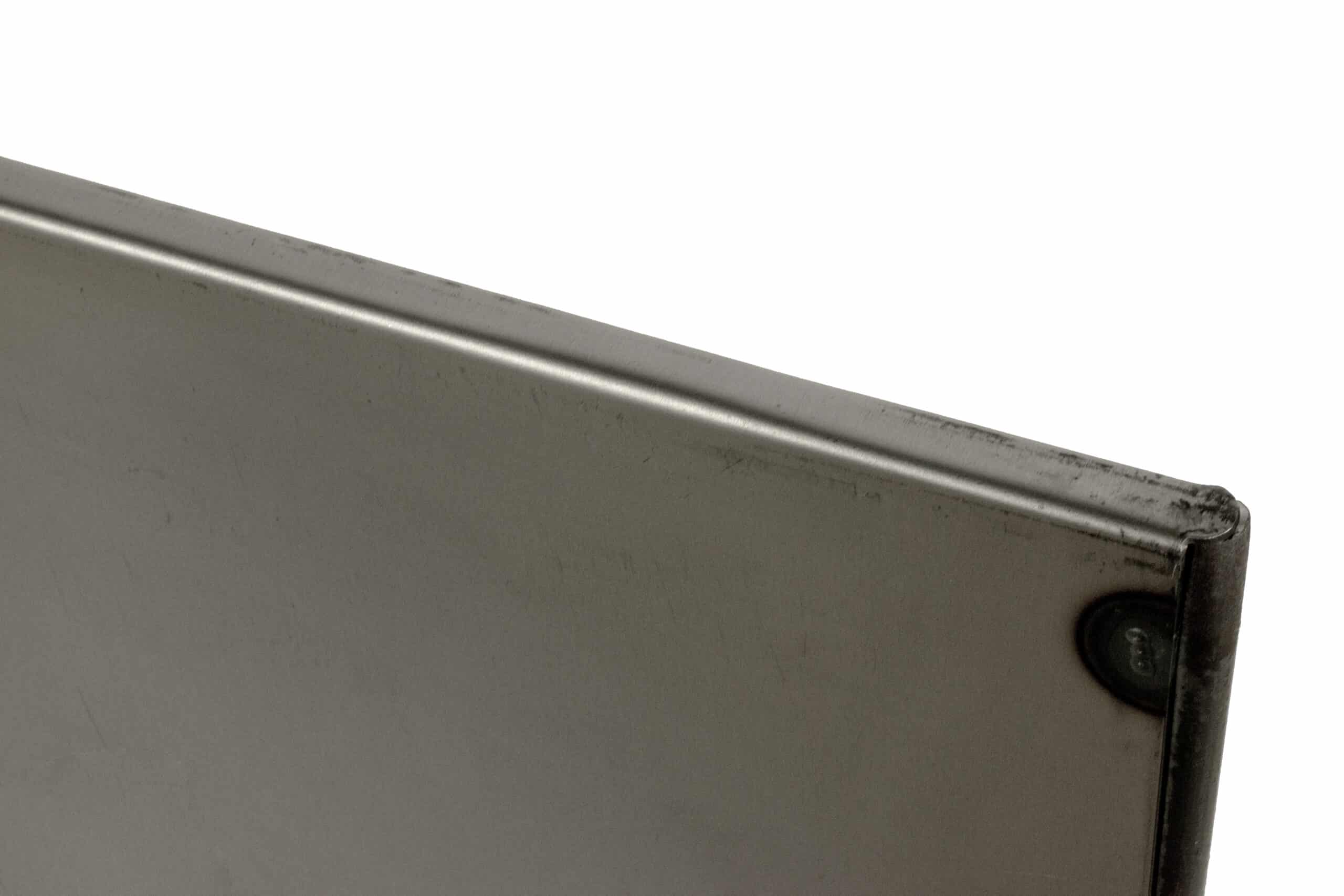 Close-up metal panel corner with rivet