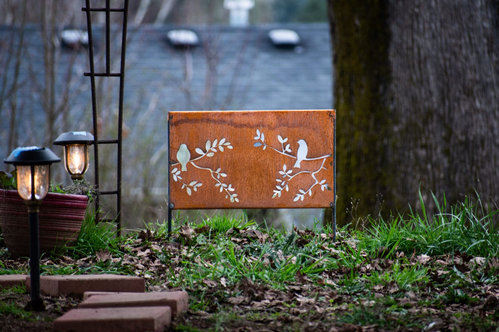 Rustic metal garden panel with bird silhouettes